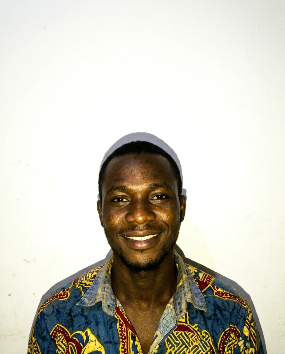 Rejected visa photo: smiling, shadow behind the head, overexposed background and face too small